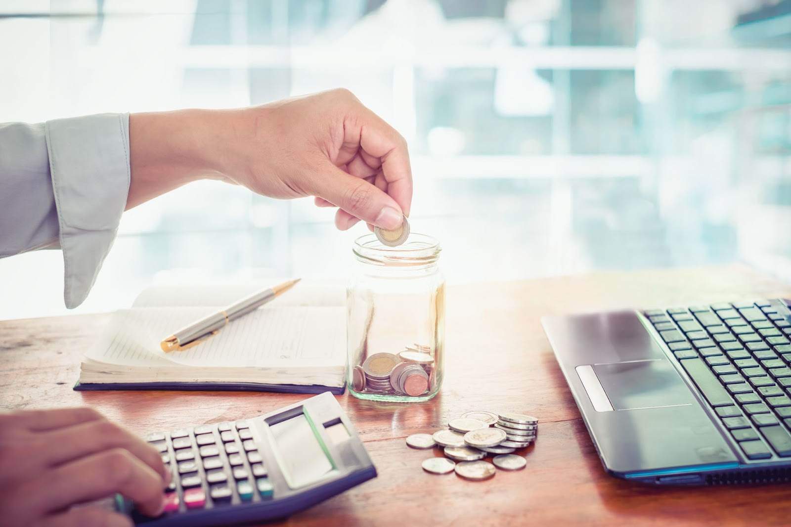 Investor calculating savings and managing financing changes with interest rate incentives, extended loan terms, and expanded credit access under OBBB.