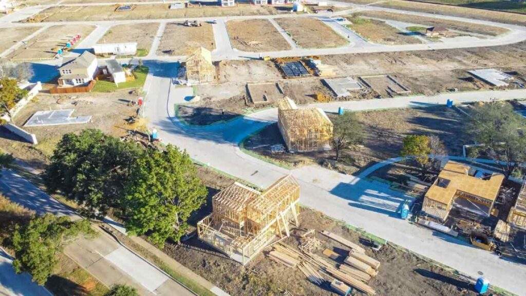 Dallas-area Residential Construction: Aerial view of wooden framing and foundations, illustrating project development and material cost exposure.