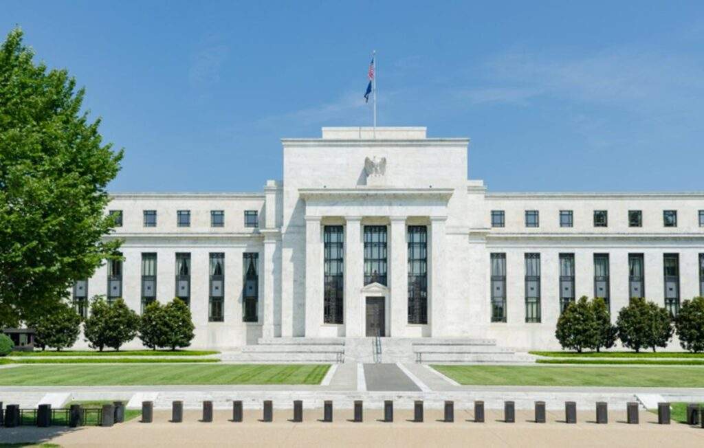 Iconic Federal Reserve Building in Washington D.C. under a clear blue sky, symbolizing monetary policy and economic stability