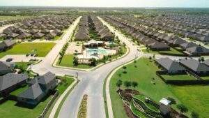 Aerial view of a master-planned community in a high-growth Texas market featuring single-family investment assets.