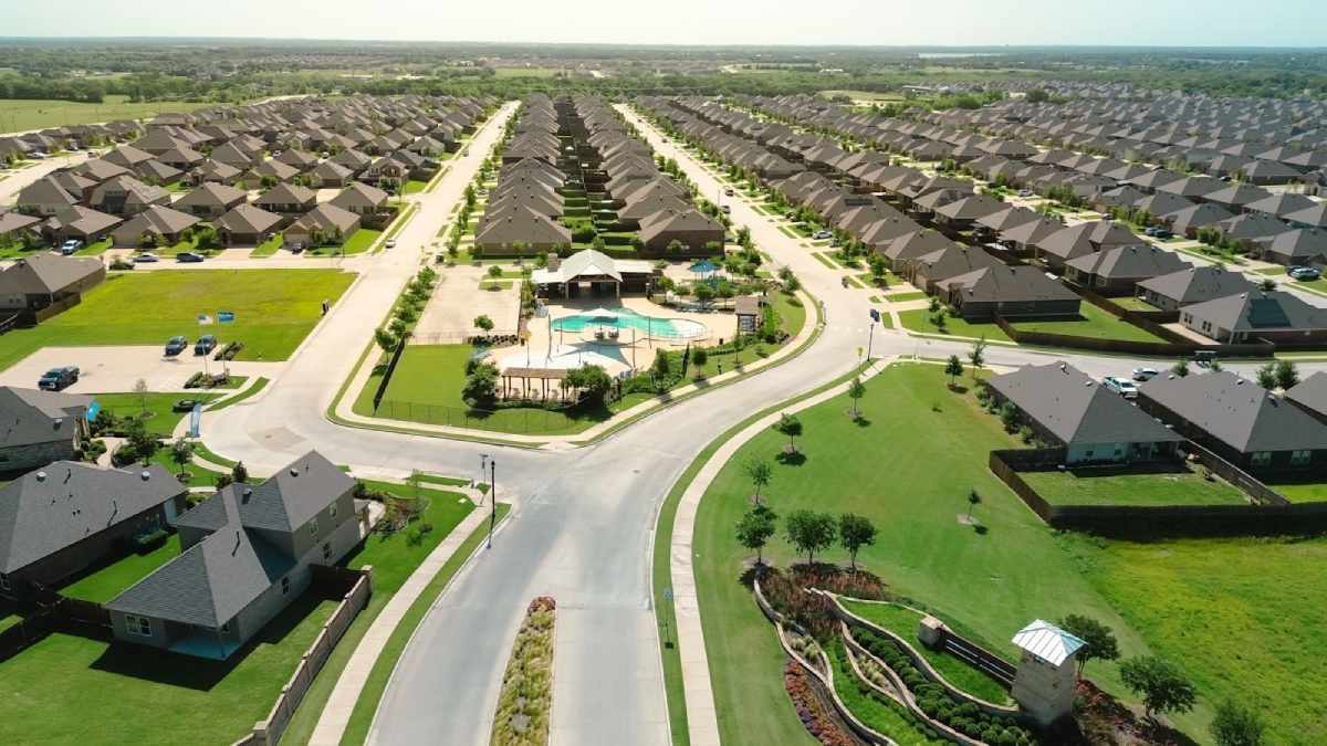 Aerial view of a master-planned community in a high-growth Texas market featuring single-family investment assets.