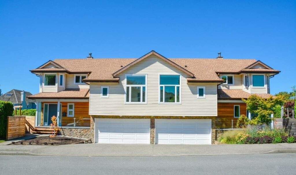 Cozy suburban duplex with separate entrances, representing a multi-unit property investment.